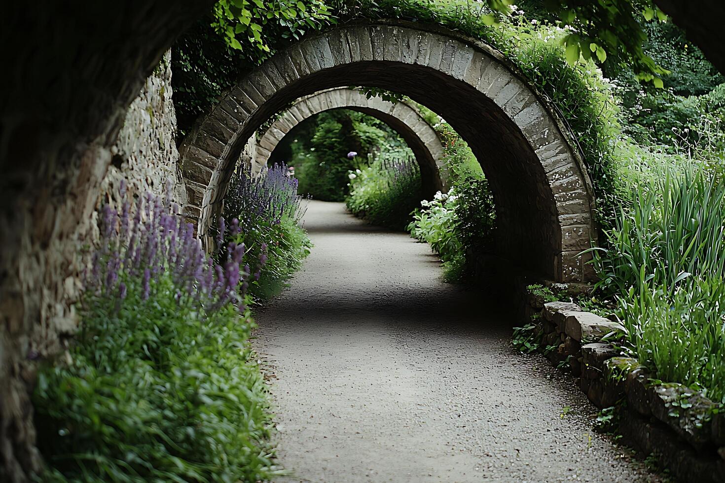 A path that is lined with stone arches photo