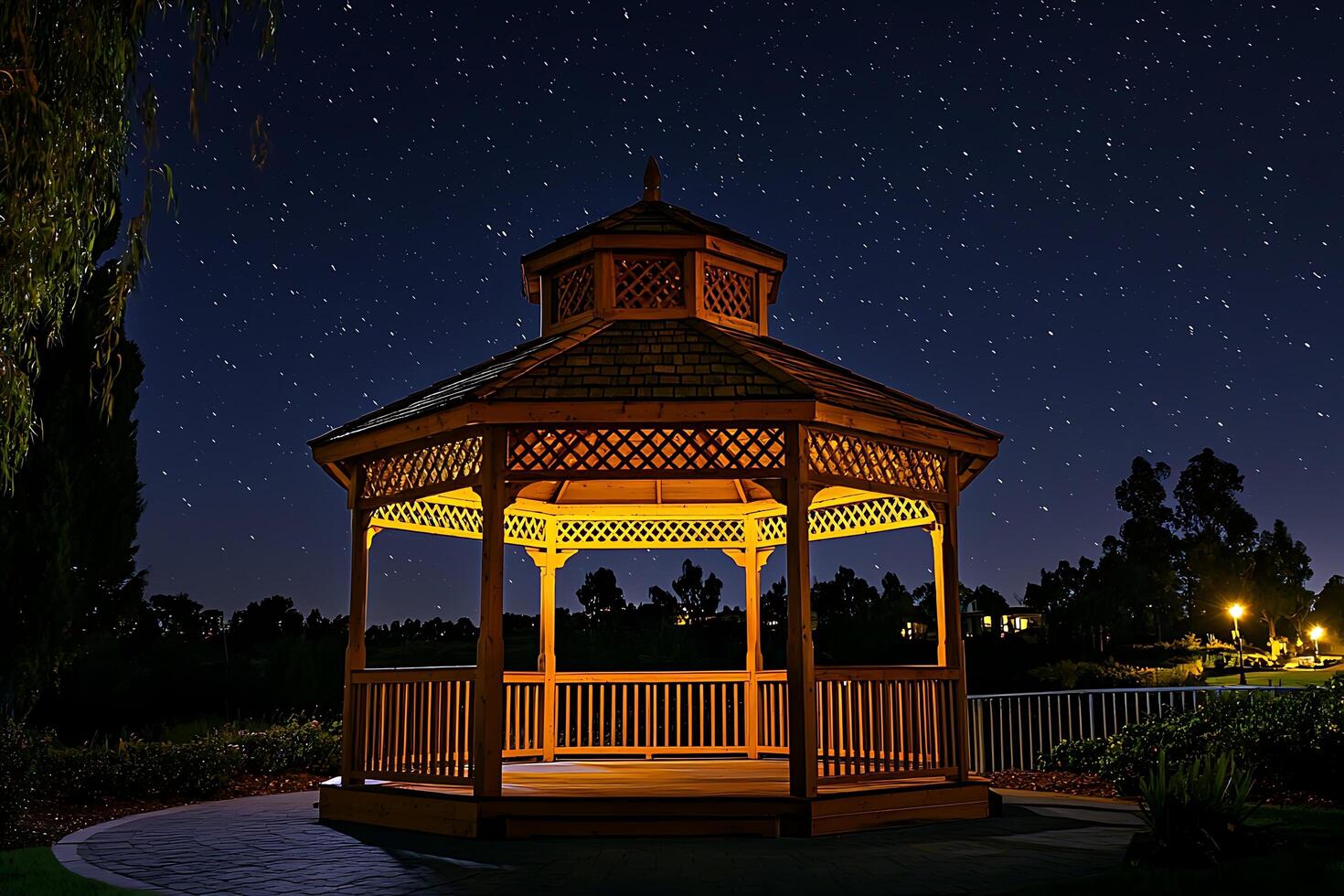Illuminated Gazebo Under a Starry Night Sky. A tranquil scene perfect for relaxation and peaceful contemplation. photo