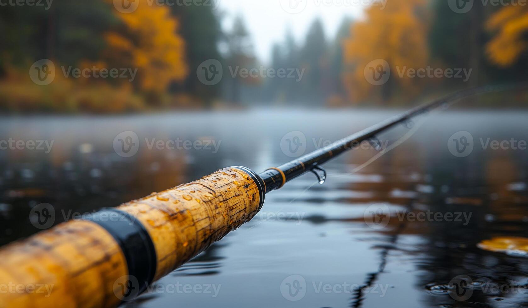 Rod on calm water, autumn trees. A fishing rod sits on the serene water, surrounded by the vibrant colors of autumn foliage in the background. photo