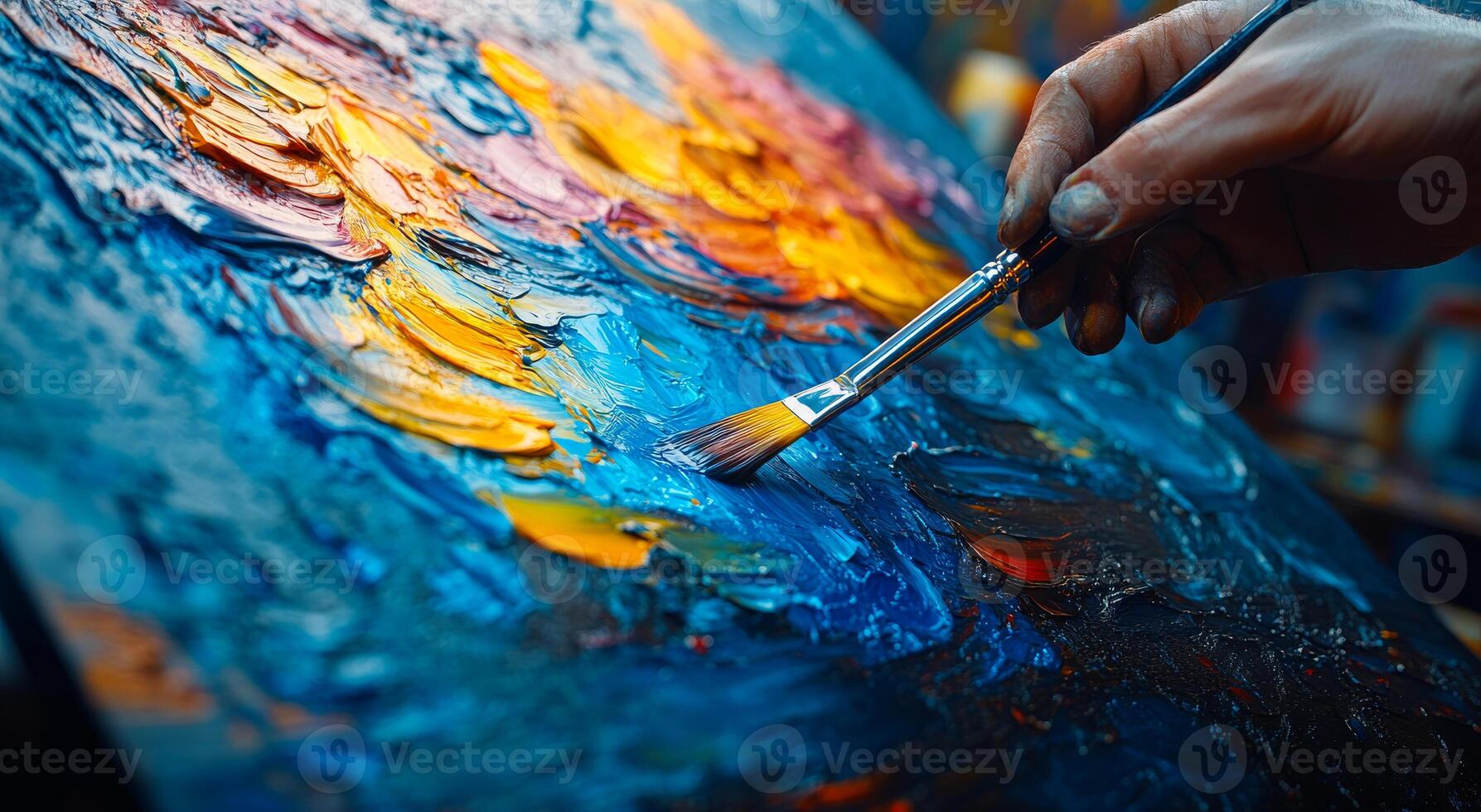 Vibrant paint strokes created. A hand skillfully applies bright colors to a textured canvas during a creative painting session in a studio. photo