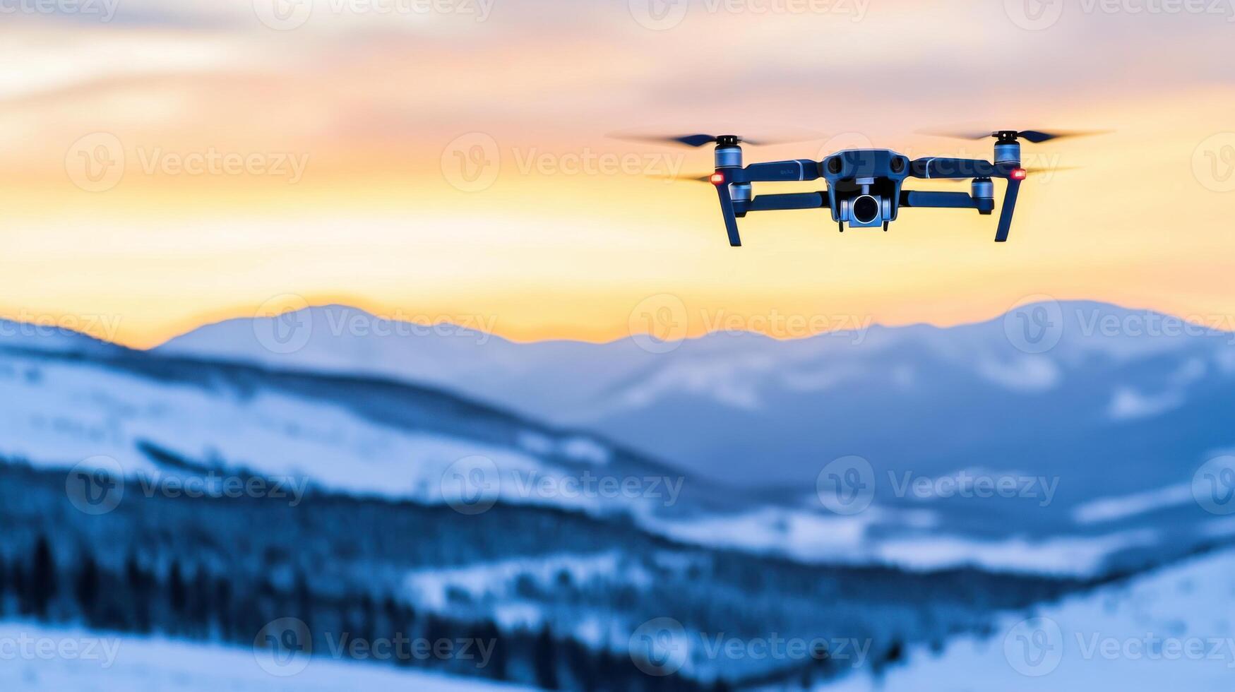 Drone soars above snowy mountains at twilight showcasing serene blue hour landscape with distant peaks photo