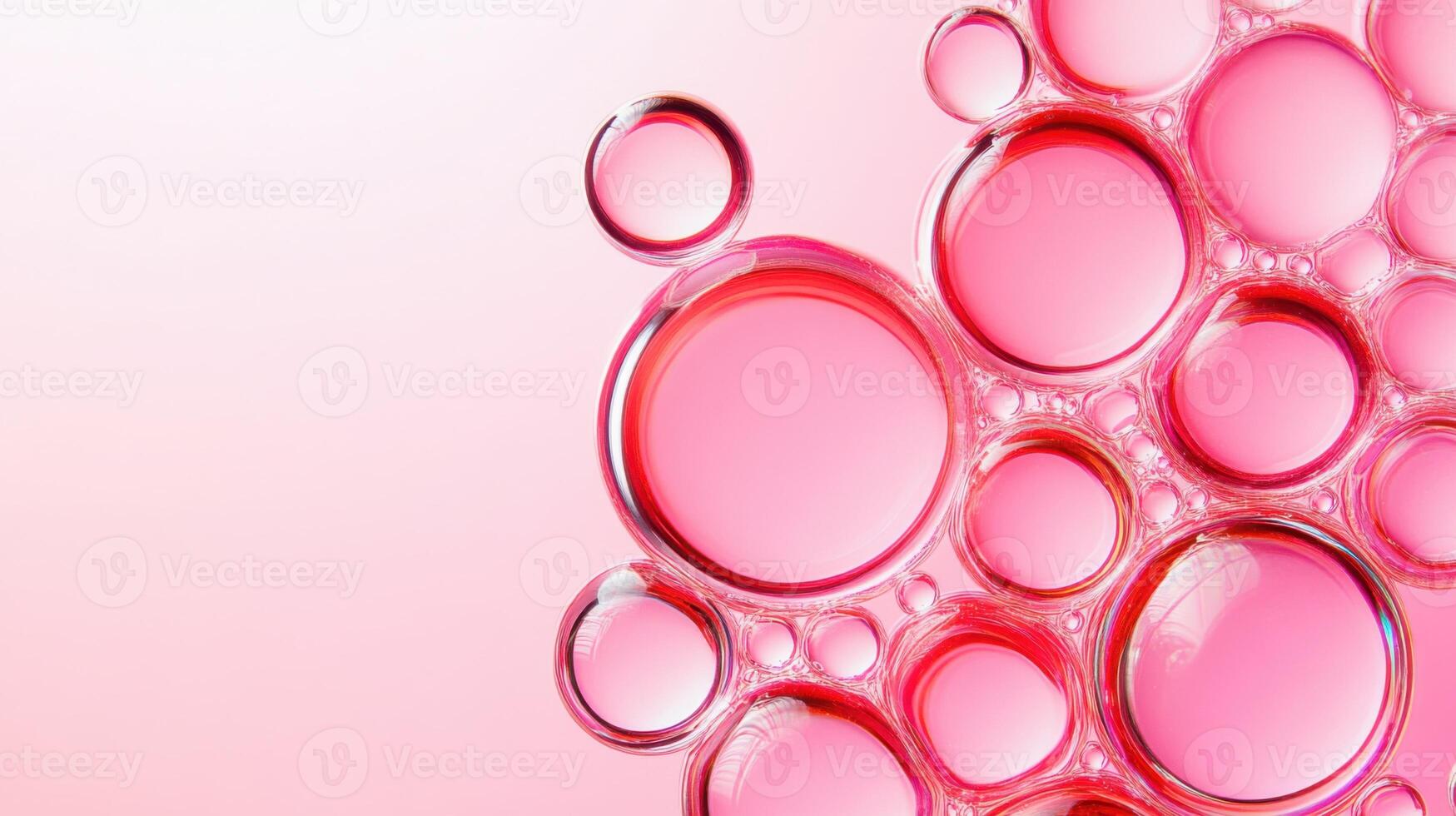 Red bubbles float in a transparent liquid illuminated by soft blush lighting, creating an abstract macro texture suitable for beauty or science themes photo