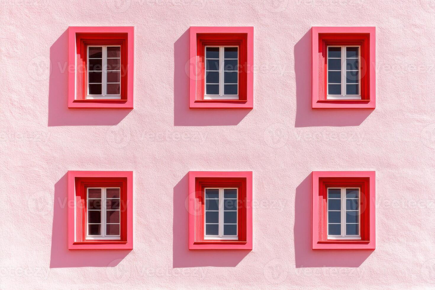 Contemporary blush wall featuring red window frames in minimalist architectural design showcasing color-block aesthetics photo