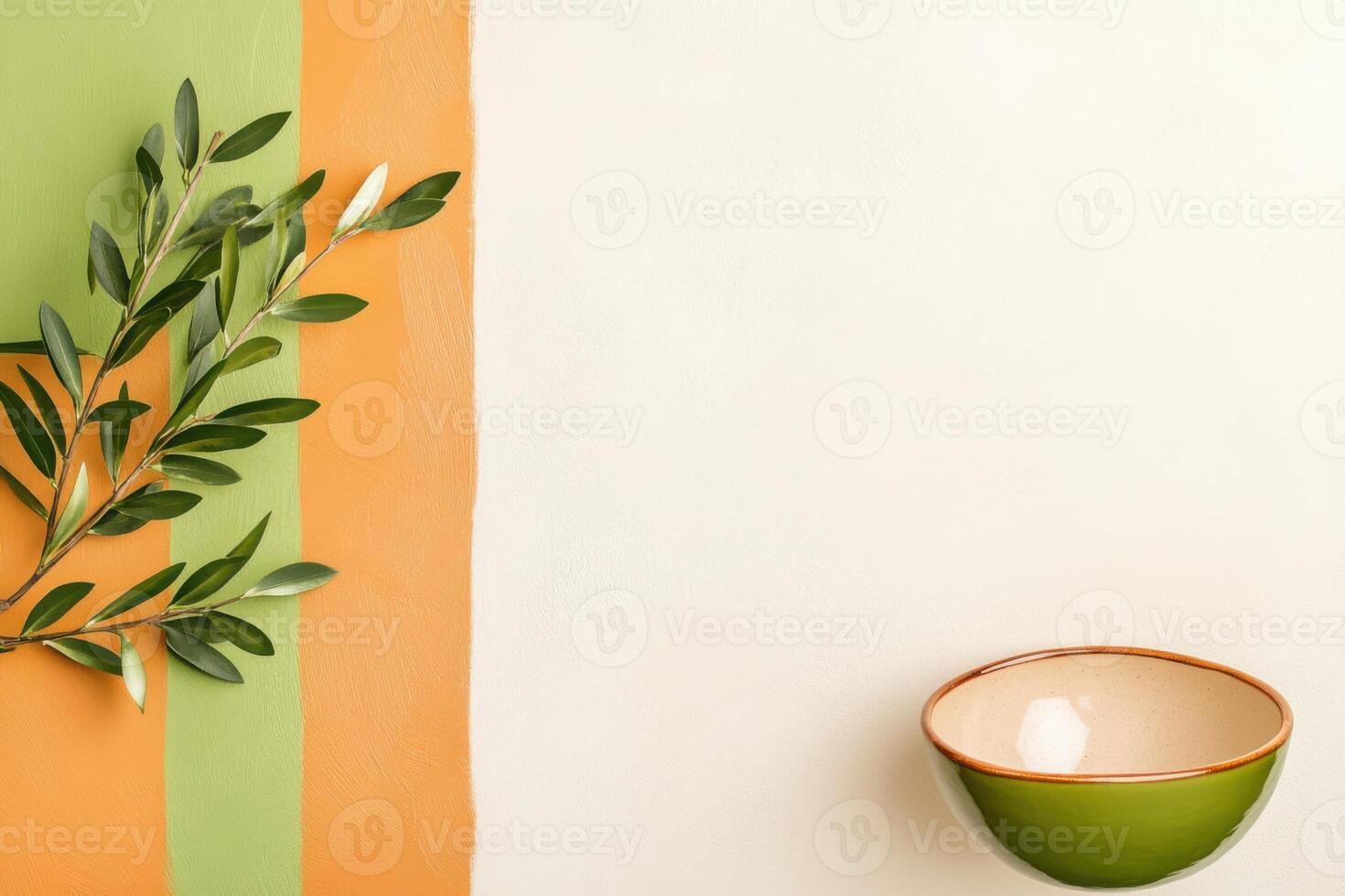 Geometric arrangement featuring textured tiles, orange and green blocks, leafy branches, and a ceramic bowl in an earthy contemporary style photo