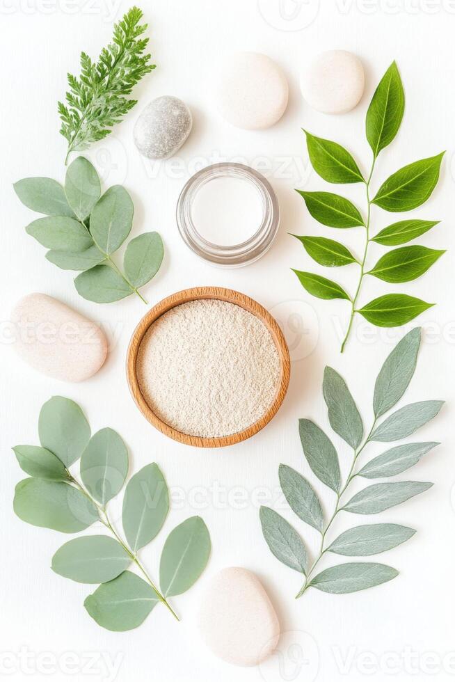 Botanical flatlay featuring green foliage, natural textures, and neutral shapes arranged in a minimalist organic style photo