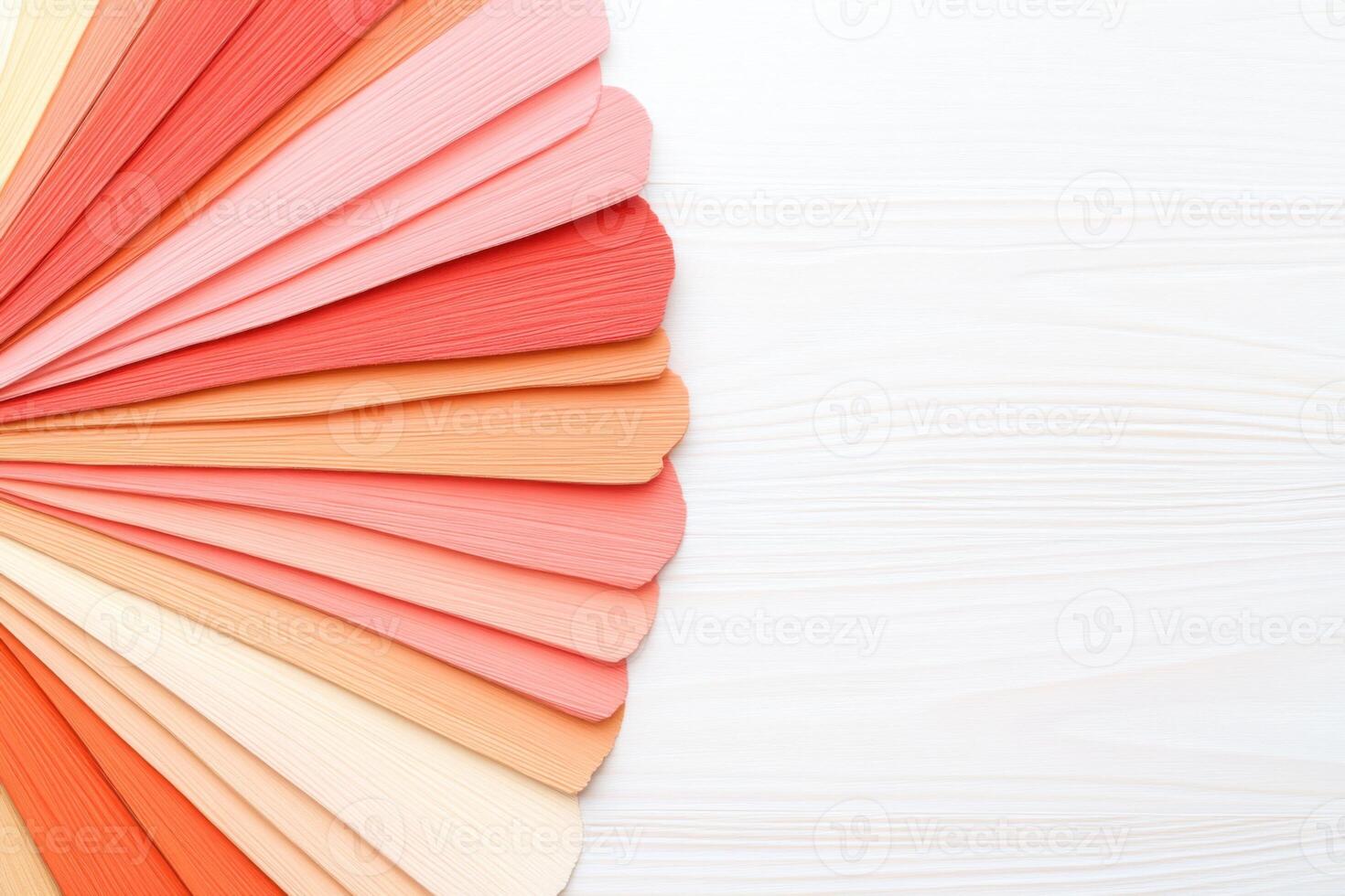 Color swatches arranged on a creative board showcasing a coral palette with deep reds, light green, neutrals, and peach tones for design inspiration photo