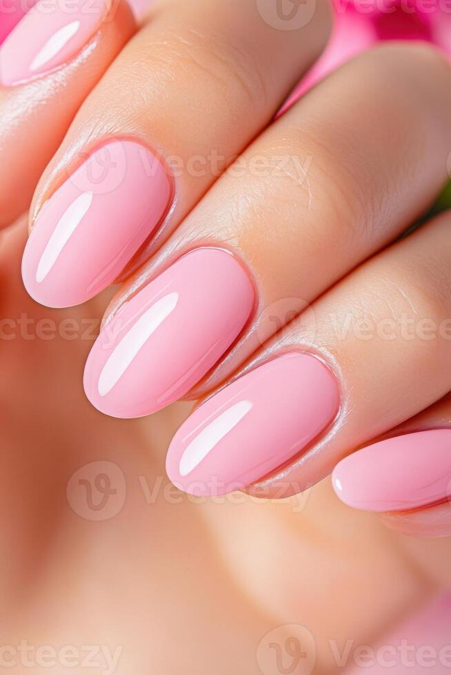 Peony pink nail polish elegantly showcased by a hand model holding a matching flower in soft editorial lighting for a beauty concept photo