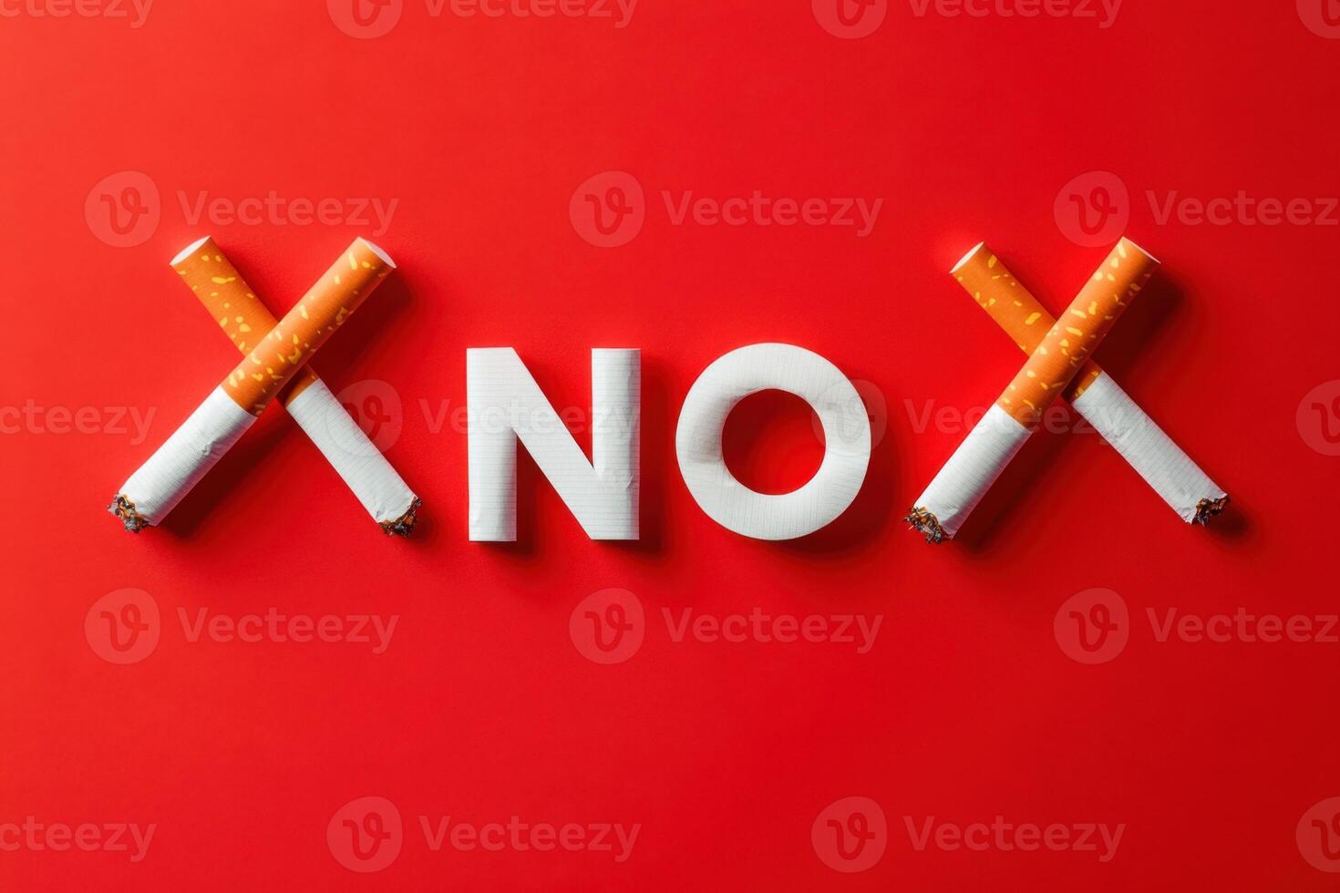 Crossed Cigarettes Forming X Shape Framing Word No on Red Background photo