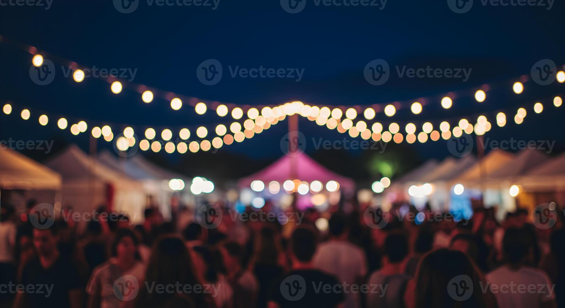Atmospheric Evening Gathering with Lights and Blurry Crowds in Festival photo