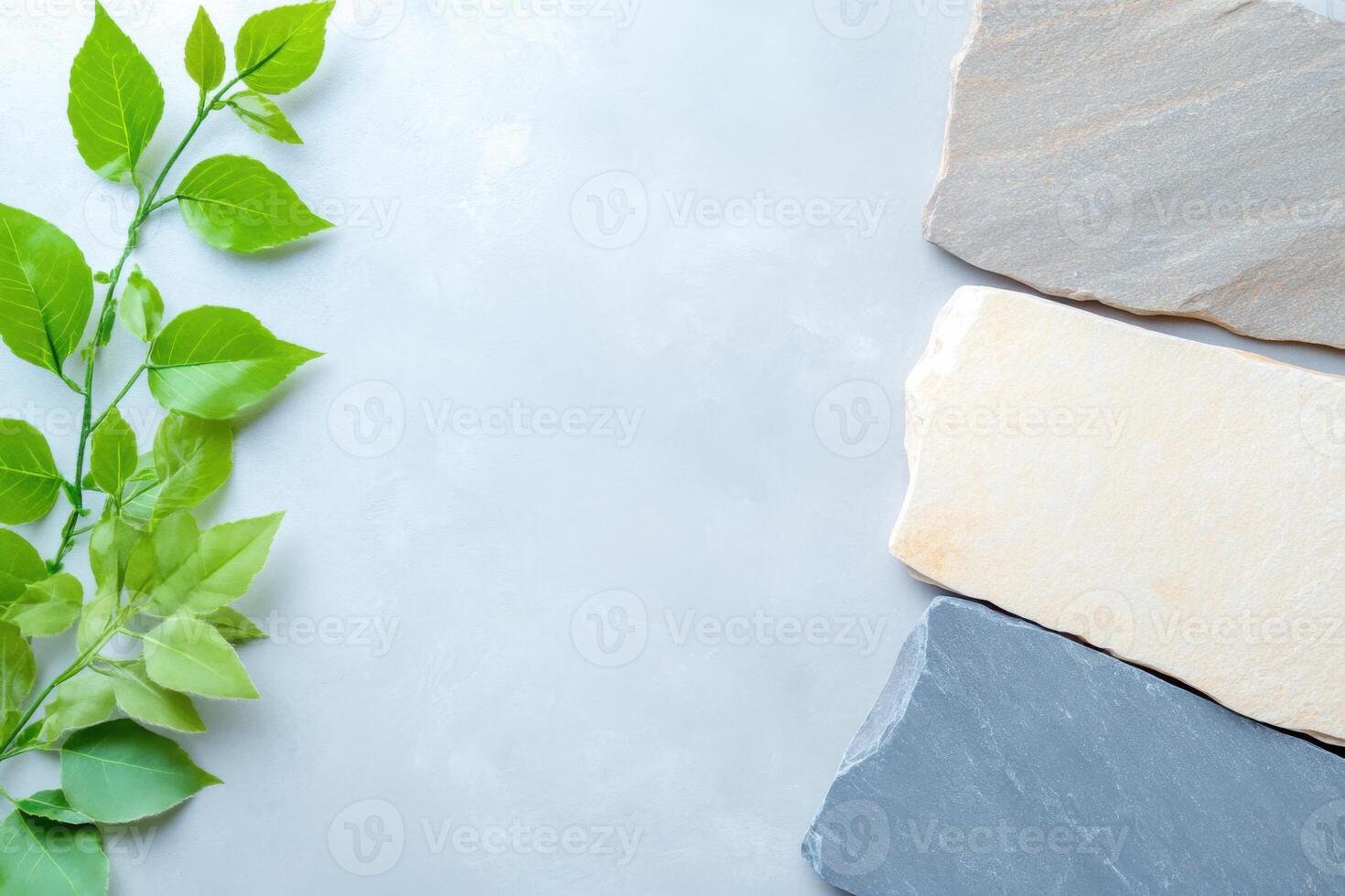 Natural stone textures flat lay with green leaves decoration photo