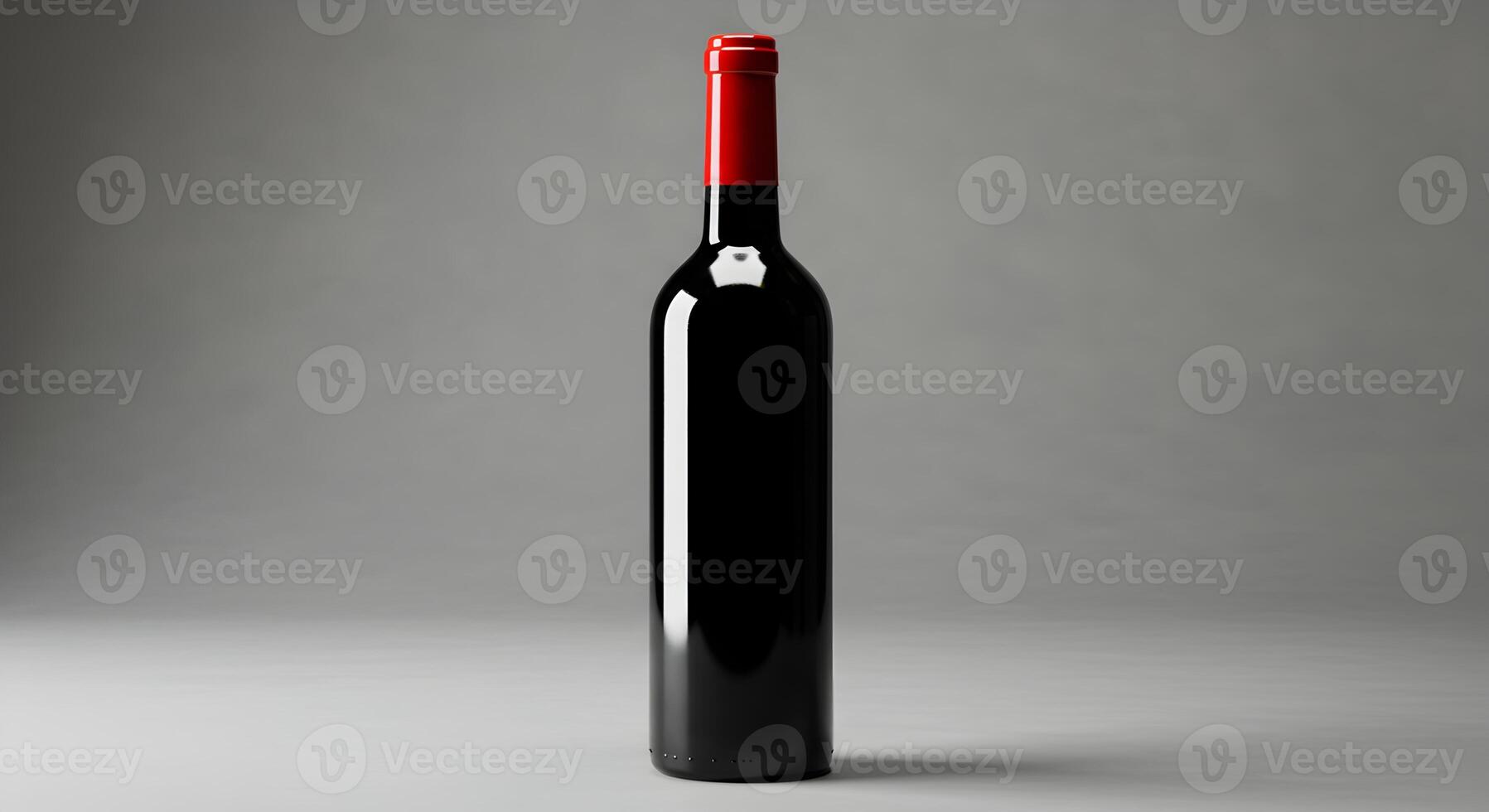 Elegant dark red wine bottle with red cap on a neutral background photo