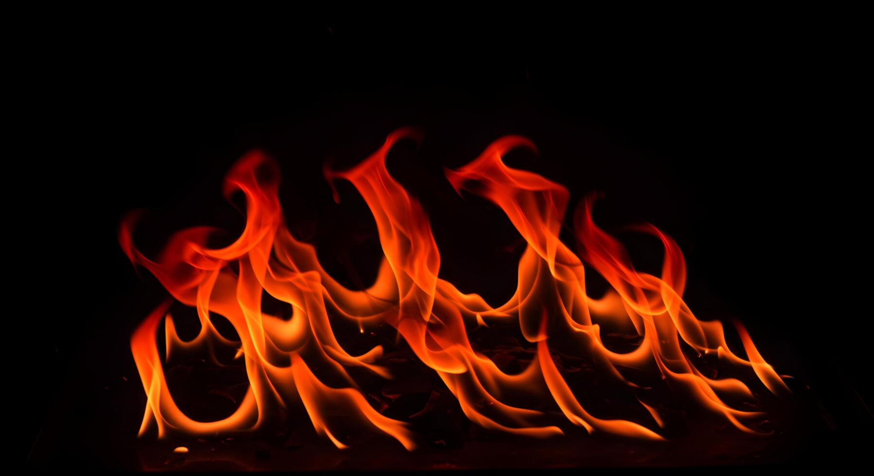 Enigmatic dance of fire against the dark backdrop, capturing nature's raw and untamed energy photo