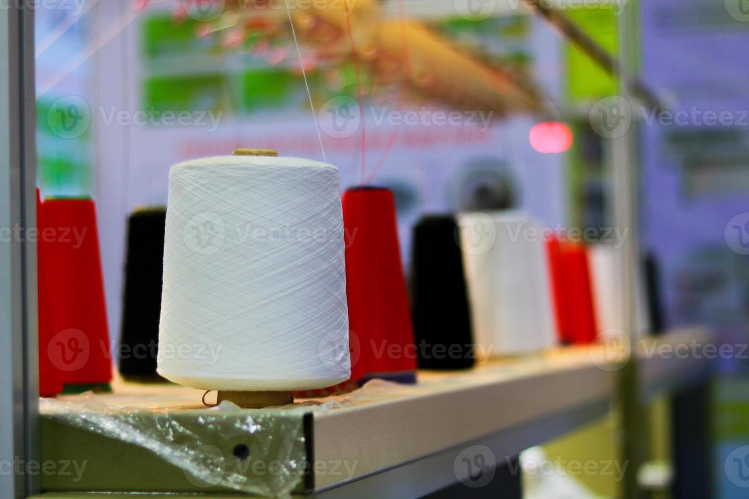Spool of threads in a textile factory, close-up of the photo