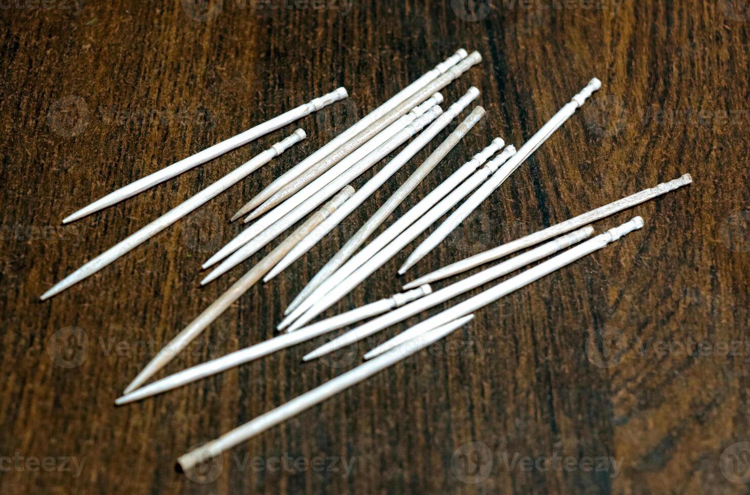 Selective focus of some toothpicks placed on a table photo
