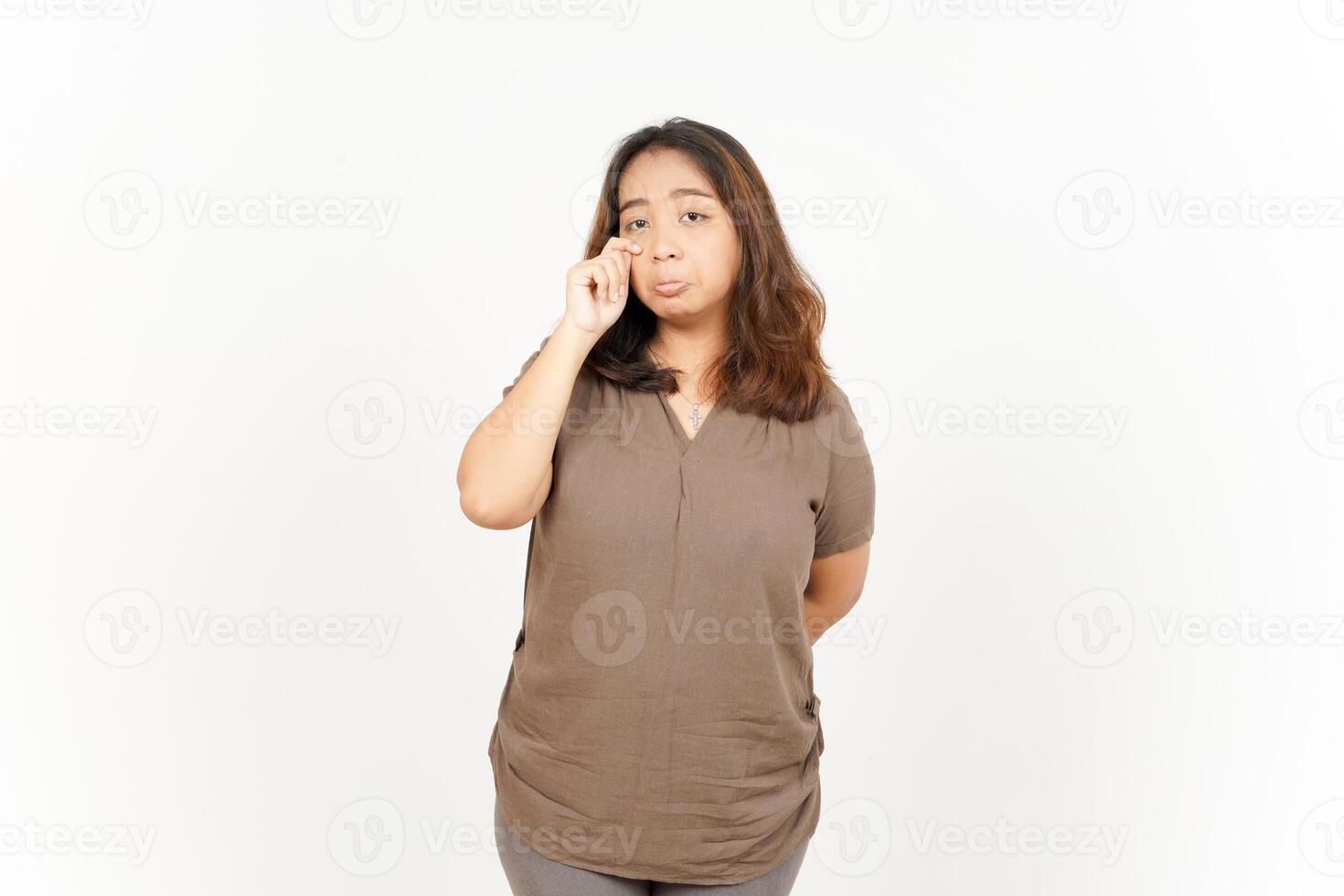 A woman is holding her hand to her mouth photo