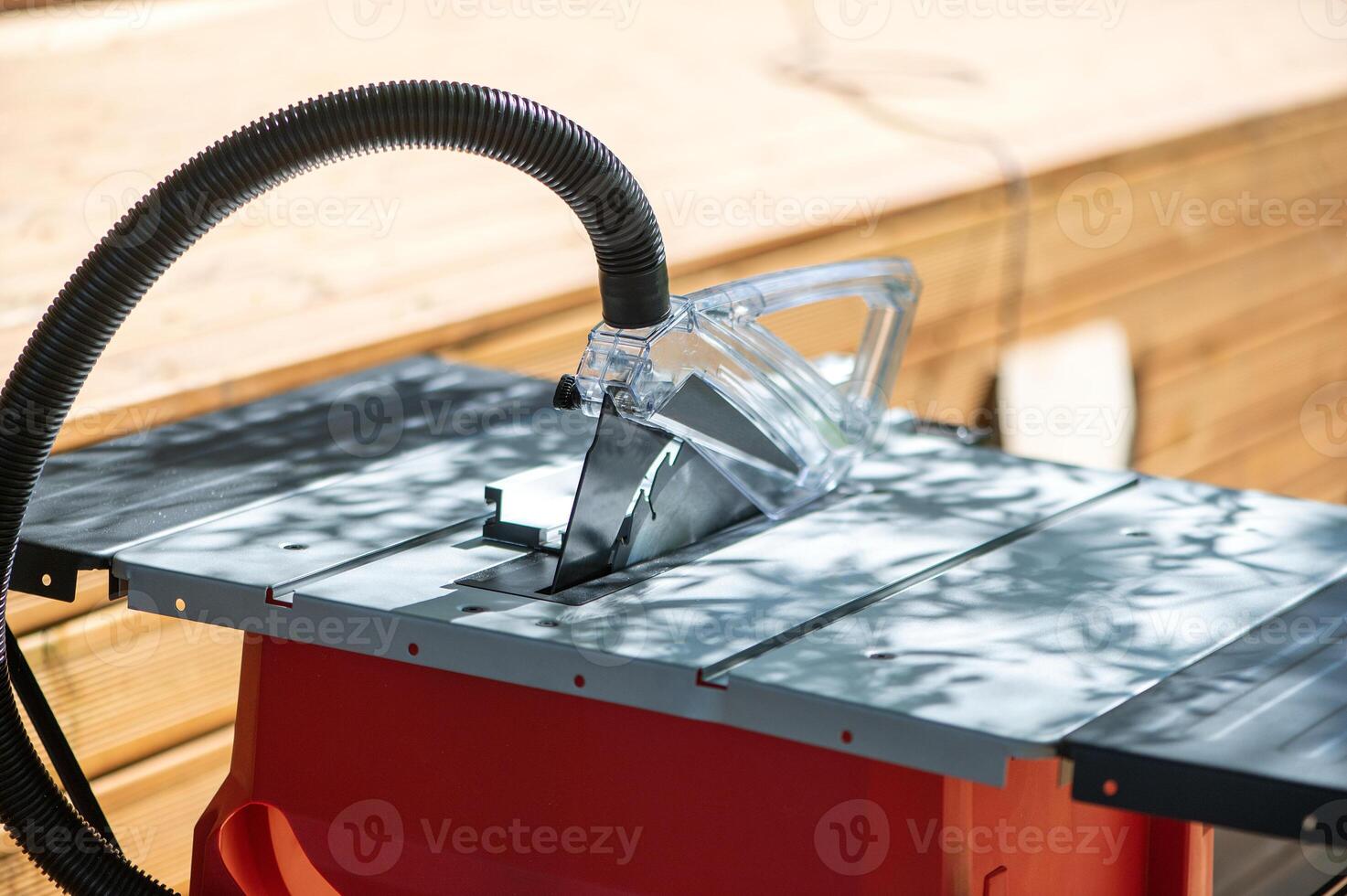 Table saw cutting wood , Circular saw blade for wood work .Carpenter tools. photo