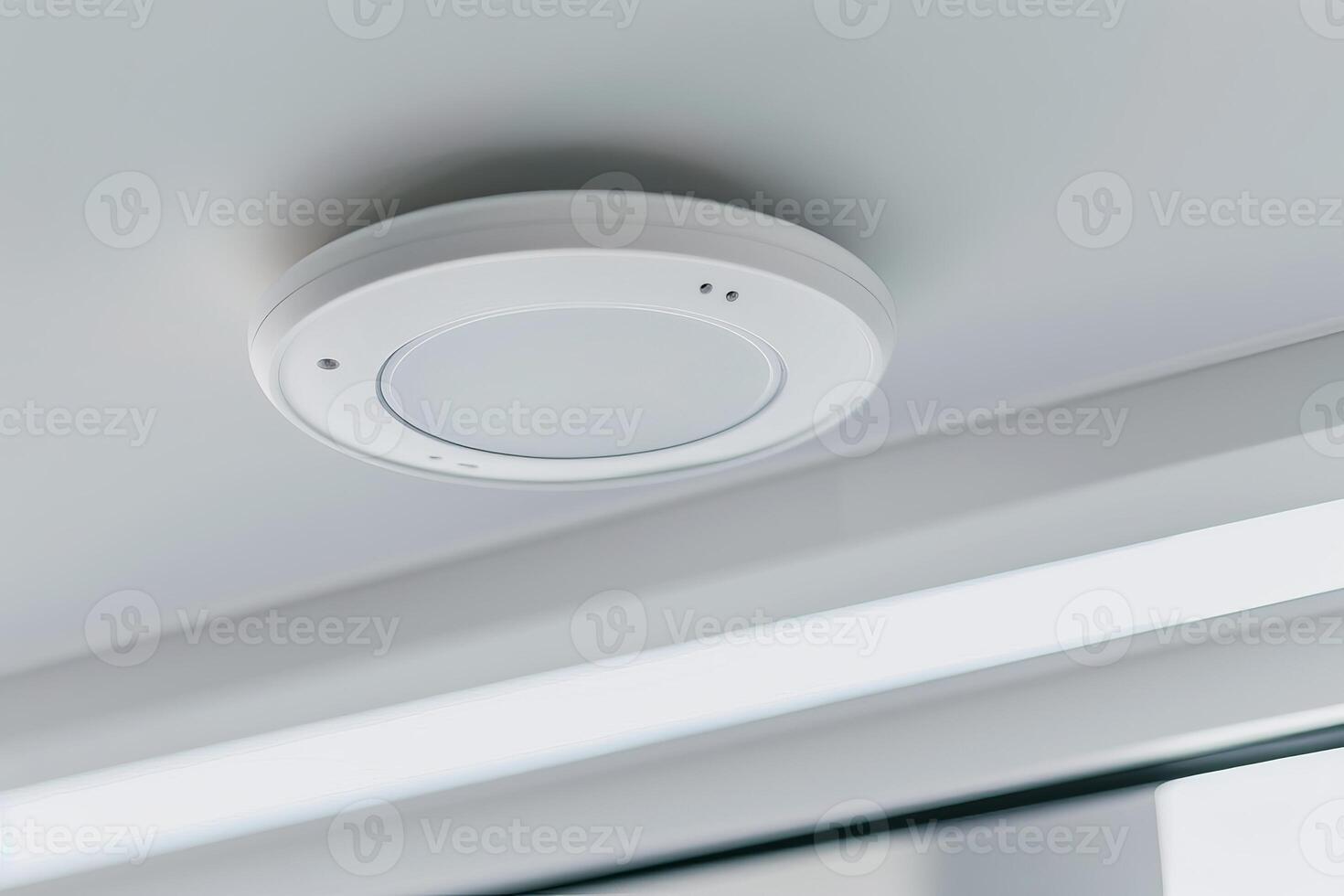 Modern ceiling smoke detector for home safety and security photo