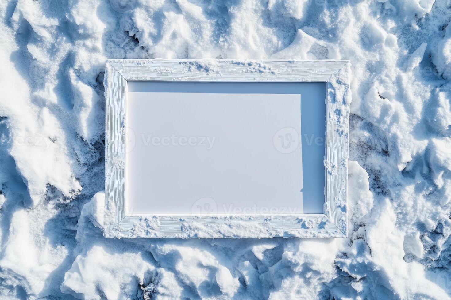 A blank white frame resting on a snowy surface, suggesting potential for creativity. photo