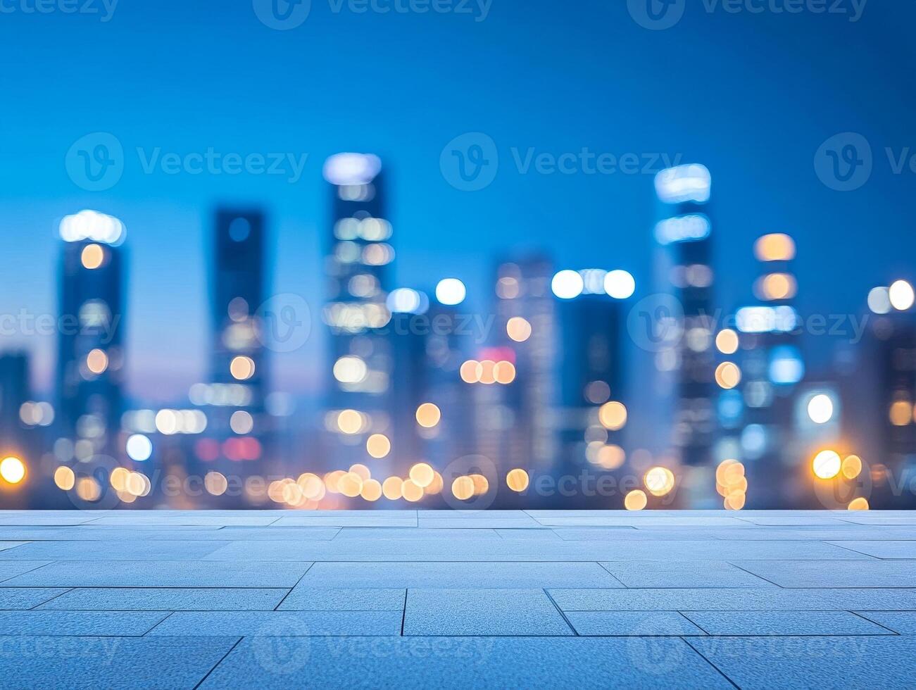 A blurred city skyline at dusk, showcasing lights and a paved foreground. photo