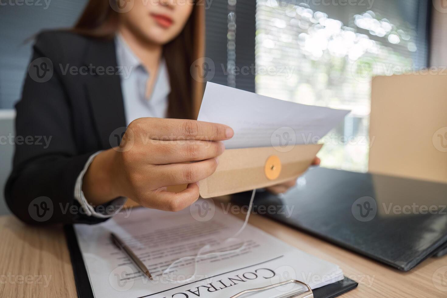 Legal Analysis and Document Management. Lawyer reviewing critical legal papers for future endeavors. photo