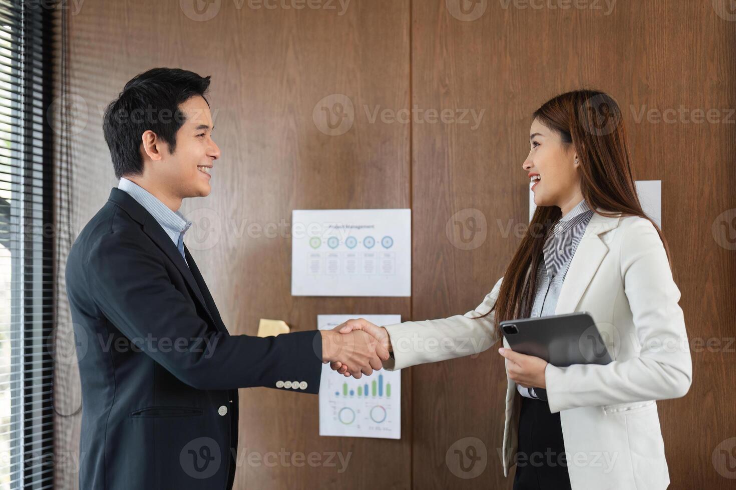 Networking and Agreement. A pleasant handshake signifies successful collaboration between professionals in an office setting. photo