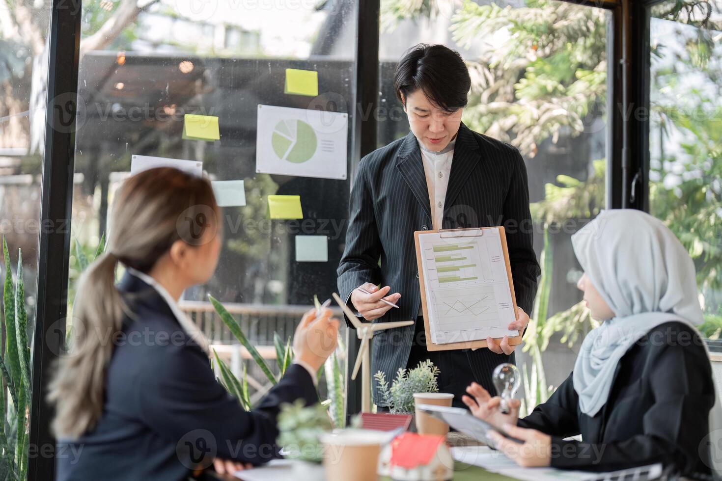 Innovation and Strategy. A team presenting eco-friendly initiatives in a sustainable architecture project. photo