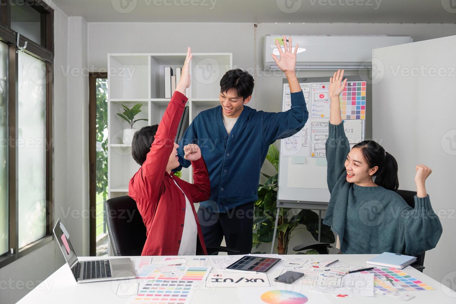 Joy and Achievement. Team members celebrate their projects success with enthusiasm. photo