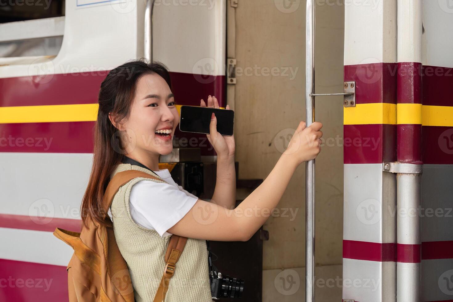 Joy and Adventure. A traveler stands at the train door, ready to embark on her journey. photo