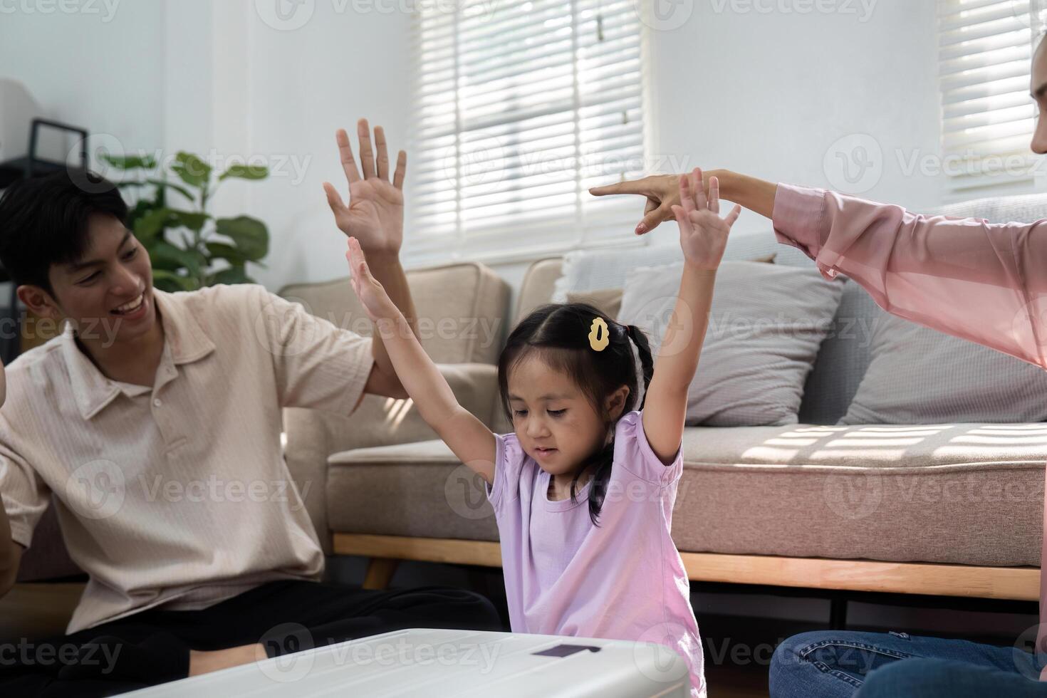 Joyful Anticipation and Family Interaction. A playful family shares laughter and excitement as they prepare for their upcoming adventure together. photo