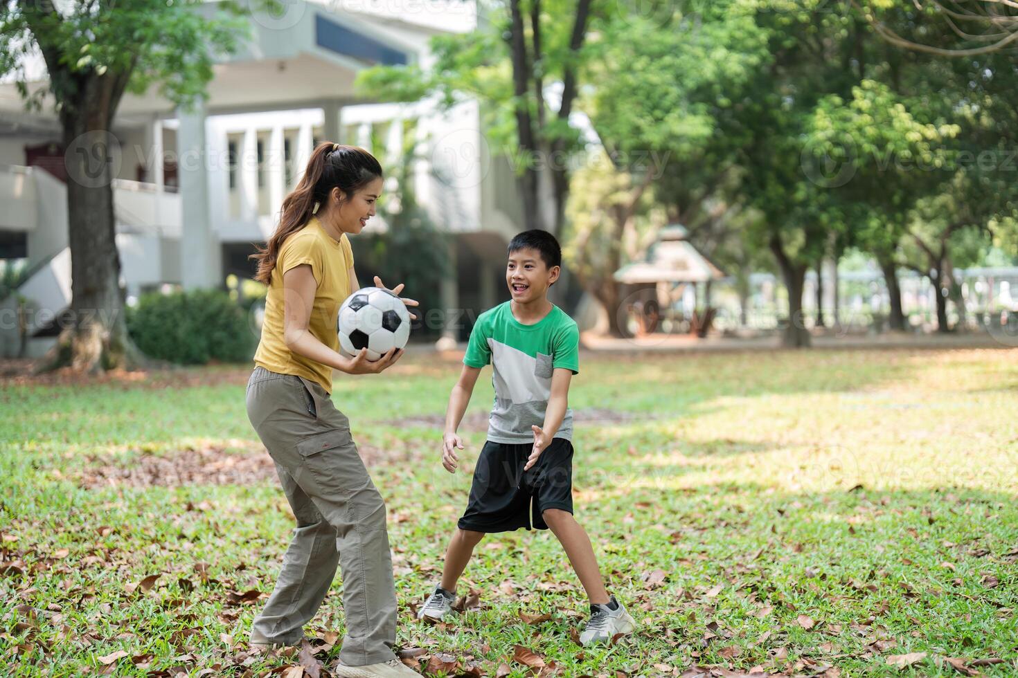 Active Lifestyle and Soccer Play. A boy and girl share a joyful game of soccer, fostering friendships and personal growth. photo