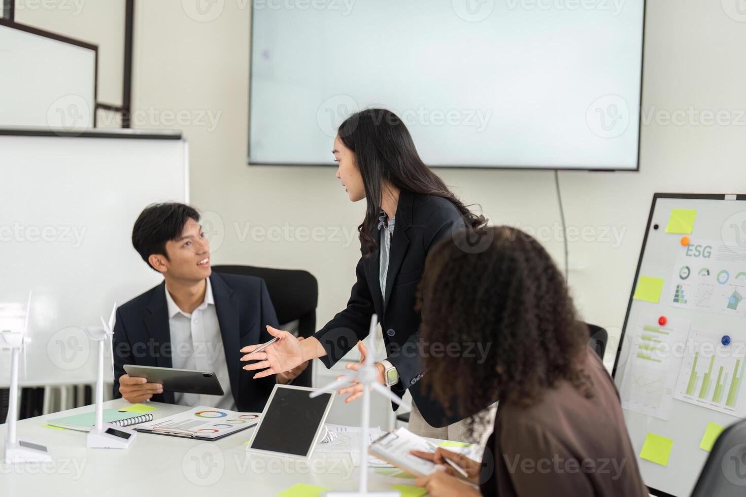 Effective Communication in ESG Strategies. Team members exchanging ideas and insights on sustainability initiatives. photo
