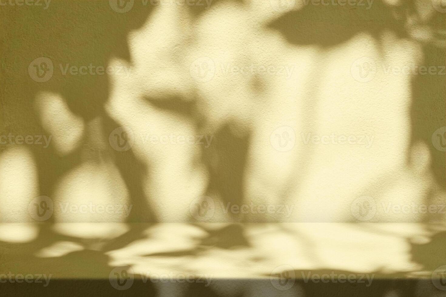 Light Gold Stucco Table with Nature Shadow on Concrete Wall Texture Background photo