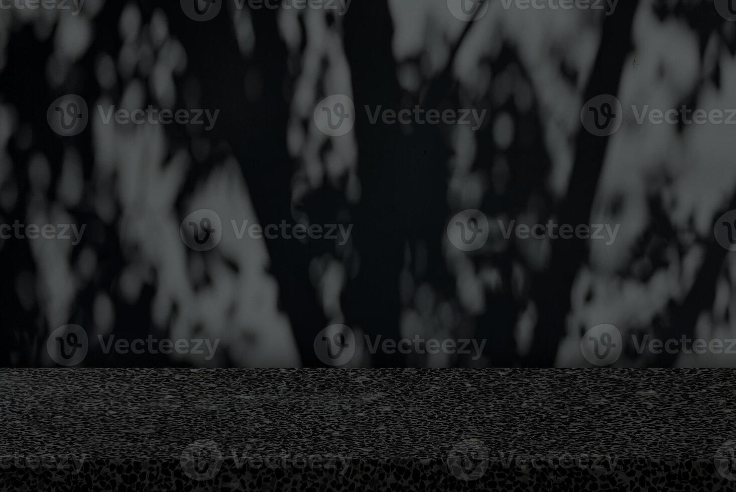 Empty Table with Scary Tree Shadow on Concrete Wall Texture Background in Dark Tone, Suitable for Product Presentation Backdrop, Display, and Mock up for Halloween Concept. photo