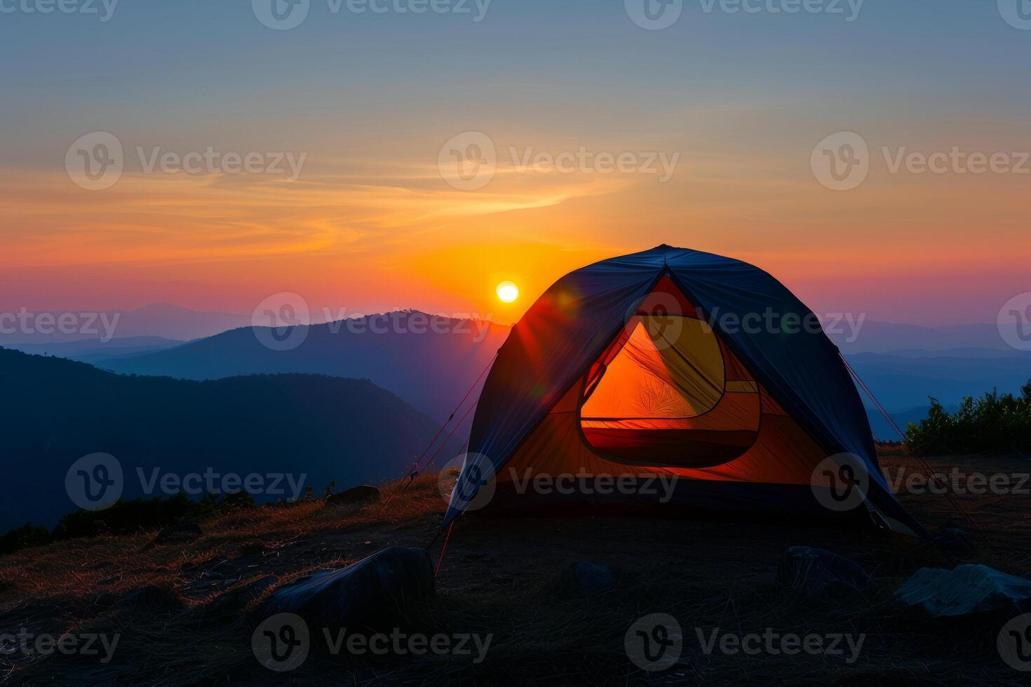 Sunset Serenity Atop The Mountain With A Perfectly Placed Tent. photo