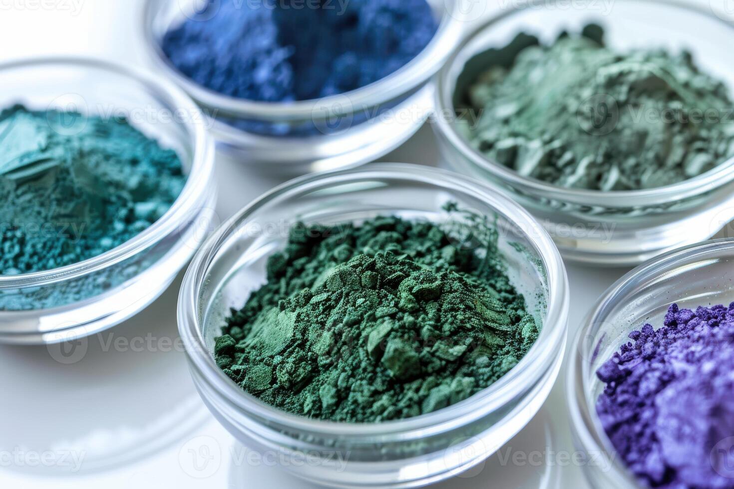 Vibrant Rare Earth Mineral Powders in Glass Bowls on Glossy Surface Perfect for Science Projects photo
