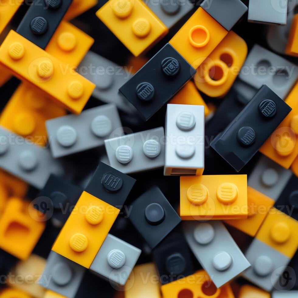 A close-up view of colorful building blocks in shades of black, gray, and yellow, perfect for creative play and innovative designs photo