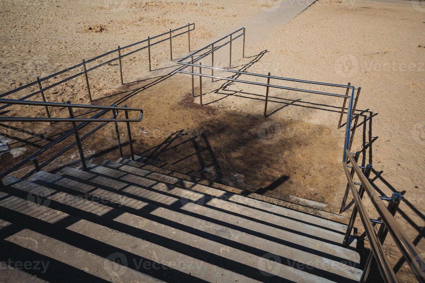 A man is riding a skateboard down a set of stairs photo