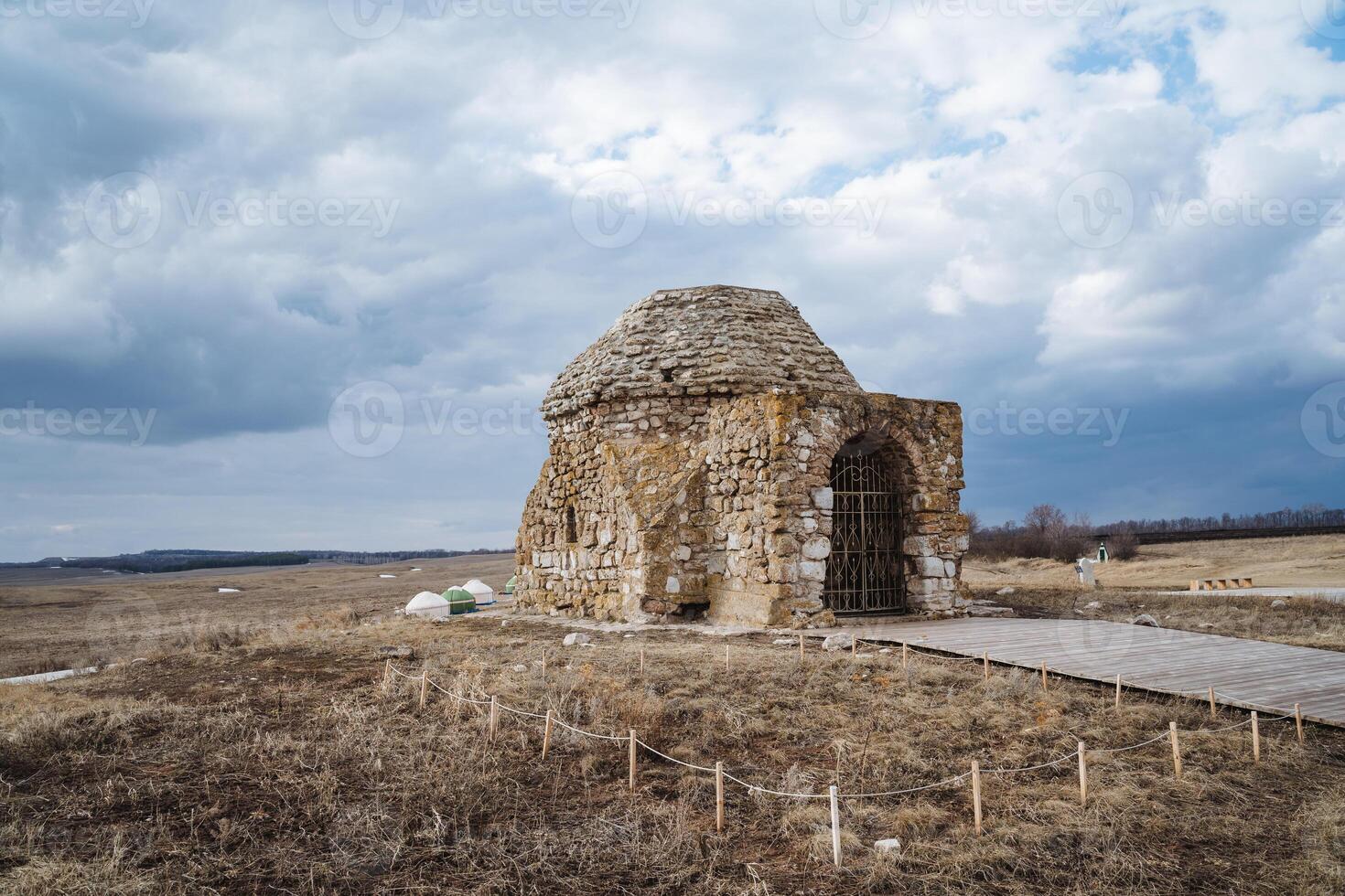 In an expansive field, a charming and quaint small stone building stands proudly, showcasing the essence of the picturesque landscape and reflecting the areas rich and fascinating history photo
