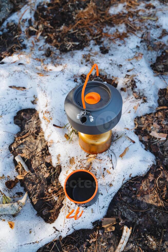 This Compact Camping Kettle is designed to perform exceptionally well on snowy ground, making it the perfect choice for outdoor adventurers who love to explore the wild photo