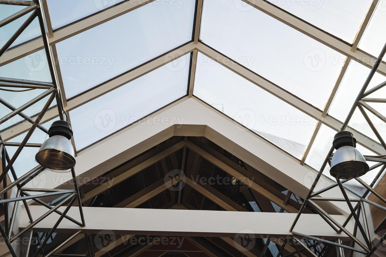 As I gaze upwards at the intricate ceiling of a building that boasts a stunning glass roof, I cant help but admire the architecture and design that makes it so impressive photo