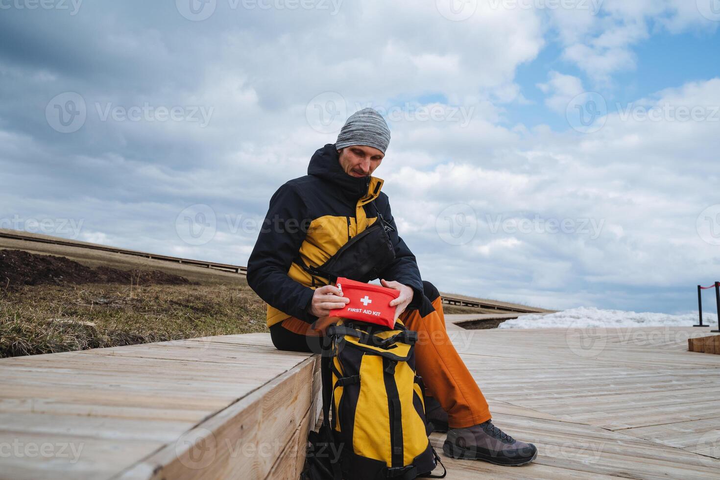 An enthusiastic adventurer is getting ready for an exciting outdoor exploration in a beautiful and scenic wilderness setting, surrounded by natures splendor and tranquility photo