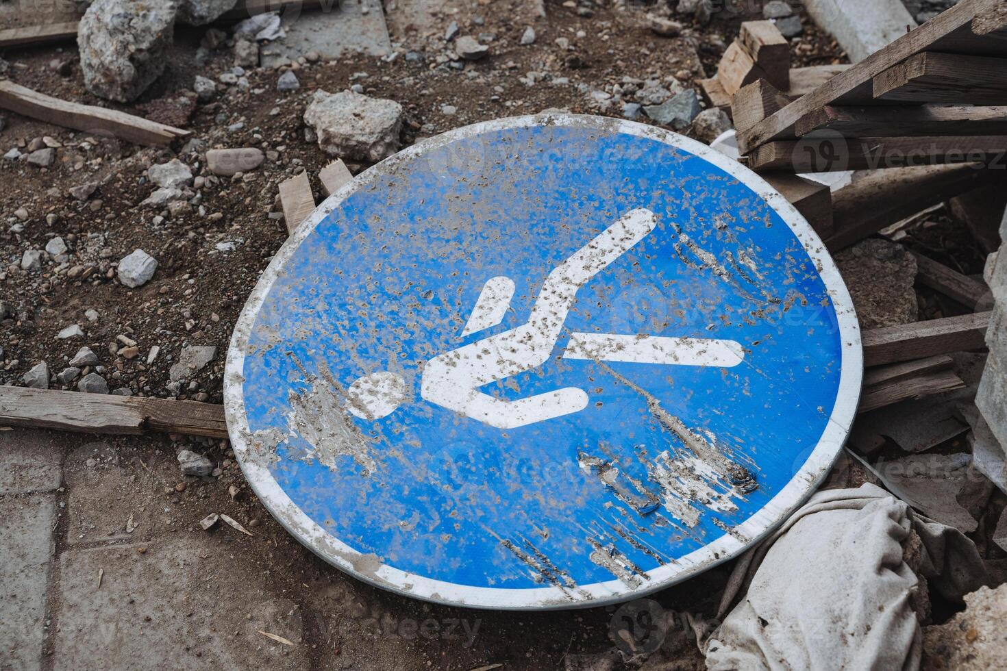 A visually striking blue and white sign prominently features a bright, rightpointing arrow, effectively assisting viewers with navigation and providing clear direction on their way photo