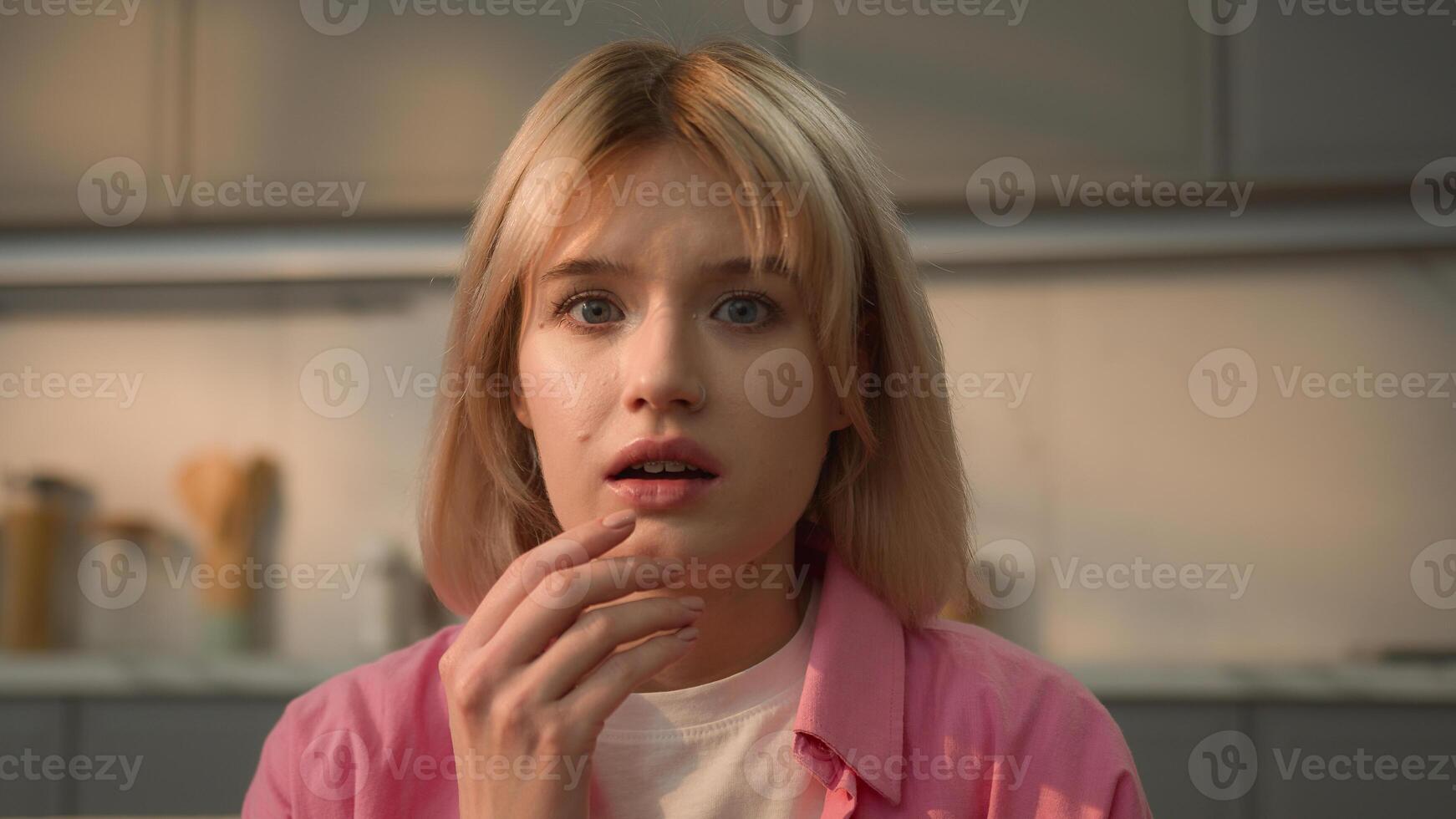 Portrait scared shocked wonder amazed problem surprise insurance credit unbelievable news open mouth shock wondering amazing confused stunned face Caucasian girl woman female at home looking at camera photo