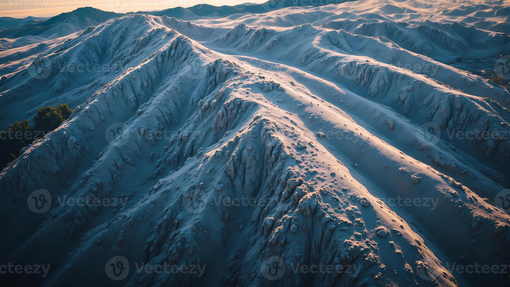 Serene Aerial View of Snow-Covered Mountain Peaks at Sunset photo