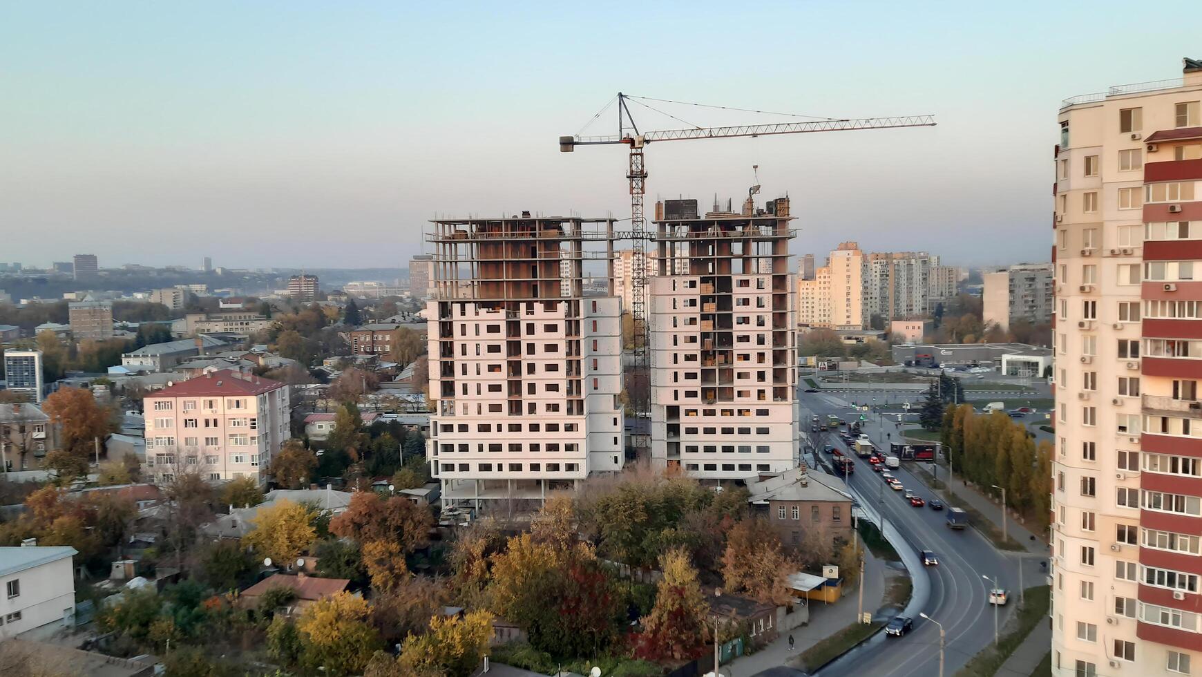 Construction in the city. Bright cityscape on a summer day sunlight envelops buildings, streets are full of life. For concepts of urban life photo