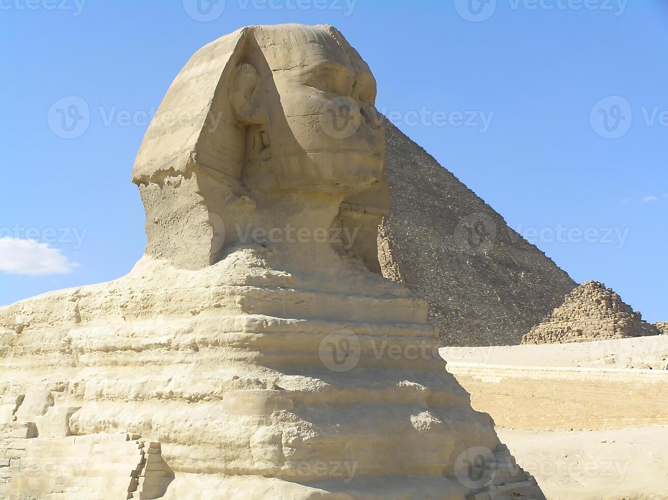 Historical value. The legendary Great Sphinx of Giza, carved from limestone, stands majestically against the vast Egyptian desert photo