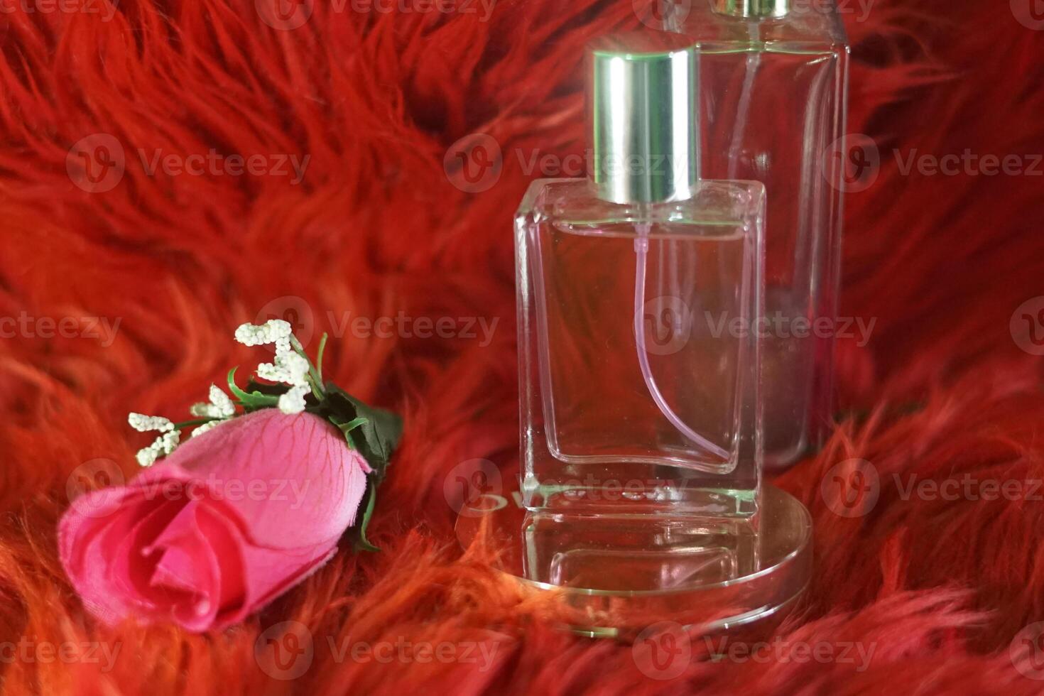 luxury Perfume bottles at display on a red background with copy space. closeup of photo. Selective focus. f photo
