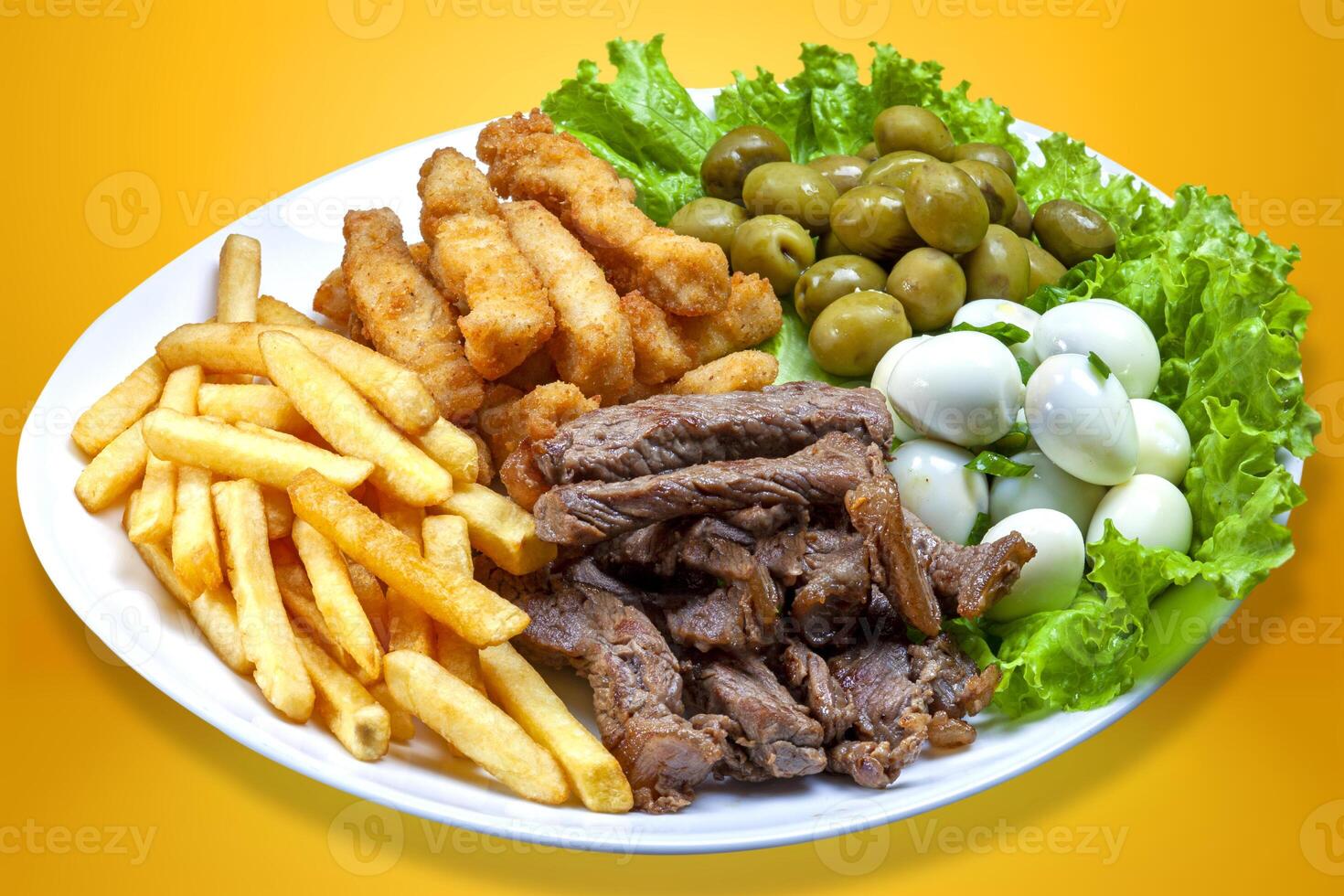 Snacks with fries, meat Picanha, quail egg, olives and breaded fish. photo