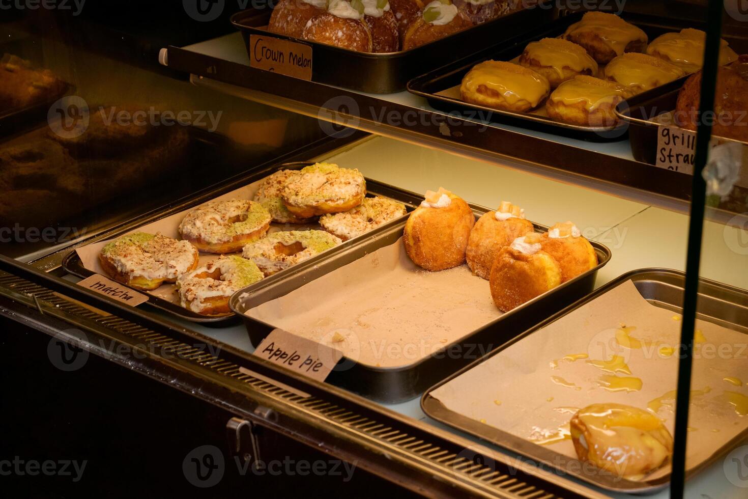 Different kinds of pastries in a bakery shop. After edits. photo