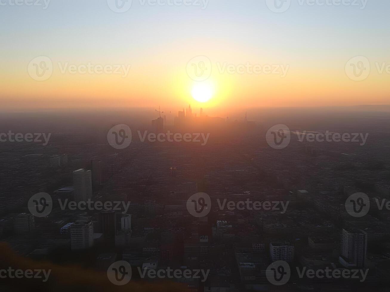 A city skyline with the sun setting over it photo